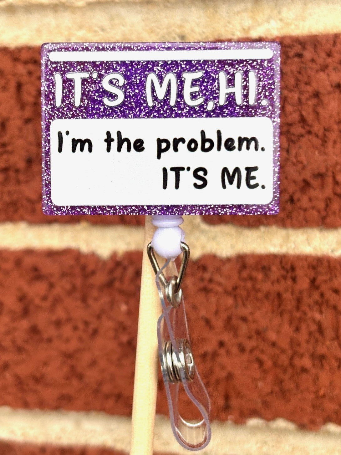 "It's me, Hi, I'm the problem" Badge Reel with Alligator clip