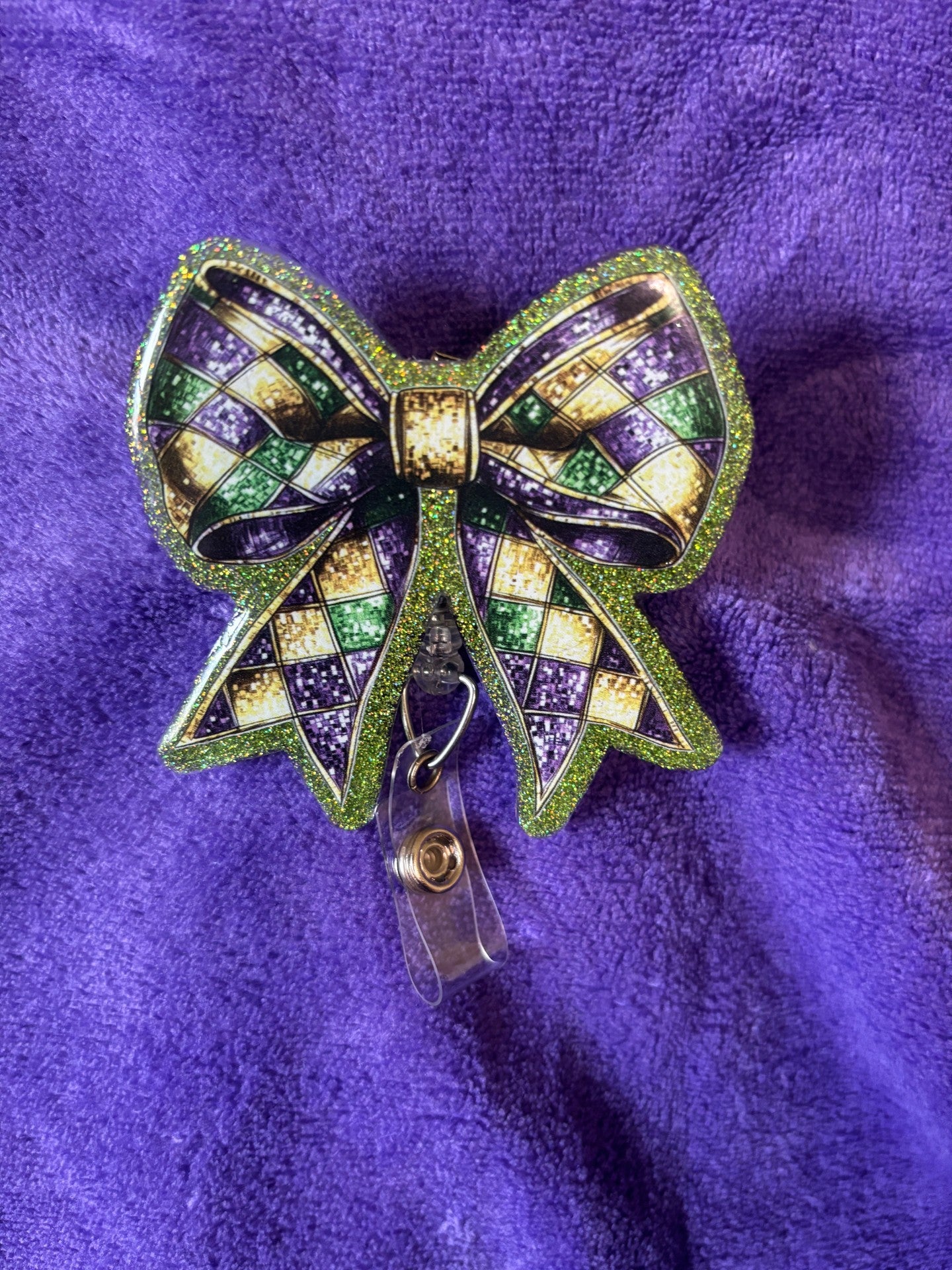 Mardi Gras Themed Bow Badge Reel