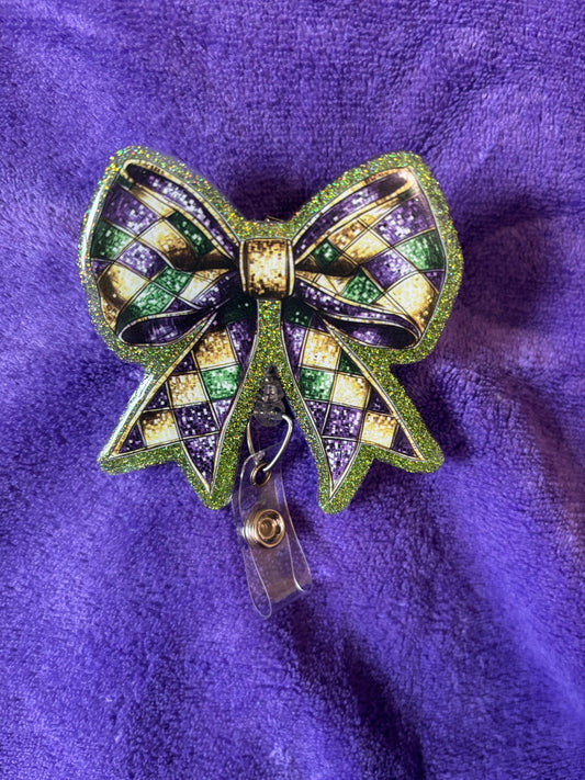 Mardi Gras Themed Bow Badge Reel