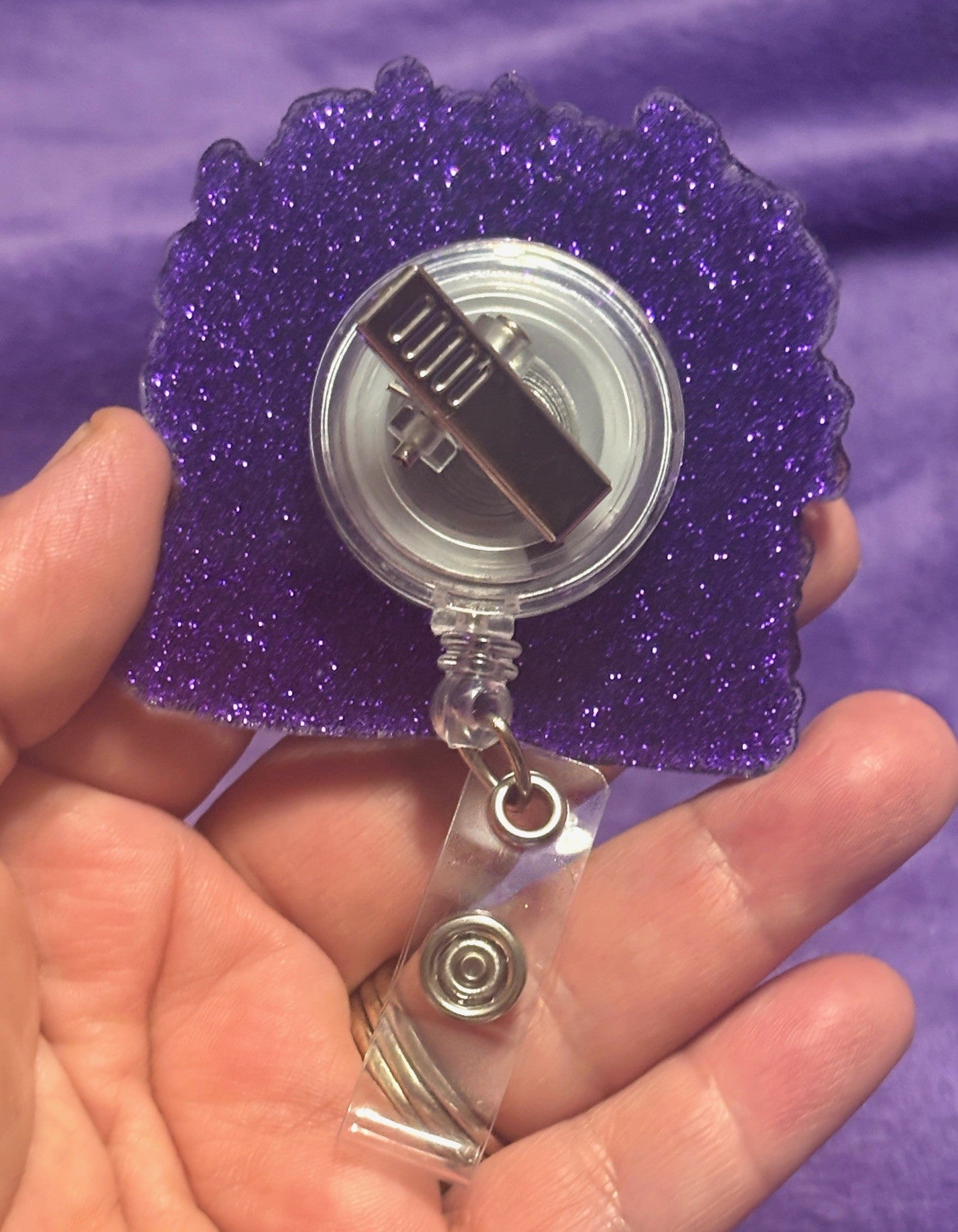 Cow in Flowers with Purple Background Badge Reel with Alligator Clip