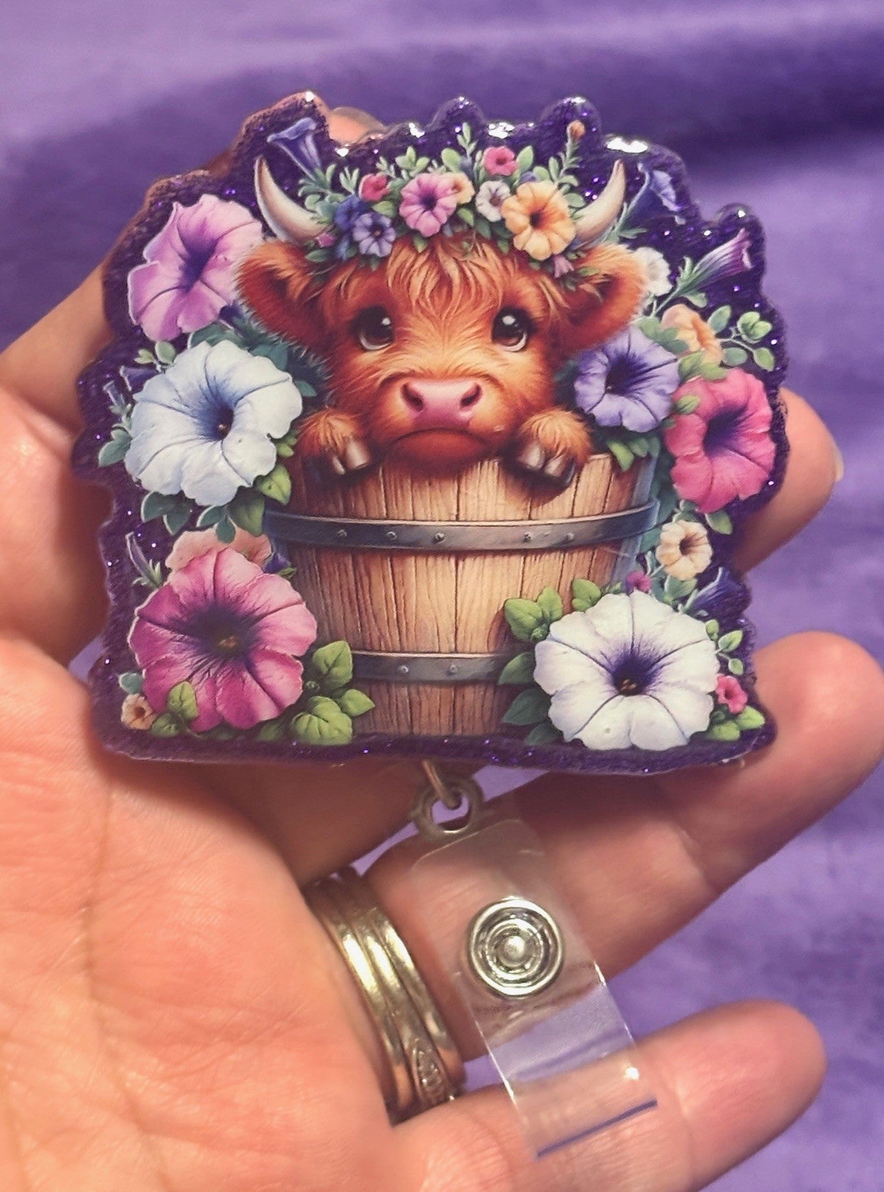 Cow in Flowers with Purple Background Badge Reel with Alligator Clip